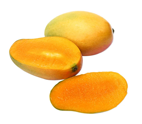 Стиглі соковиті манго на білому тлі Ліцензійні Стокові Зображення