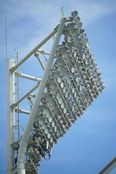 Sports stadium lighting system on a clear blue sky day
