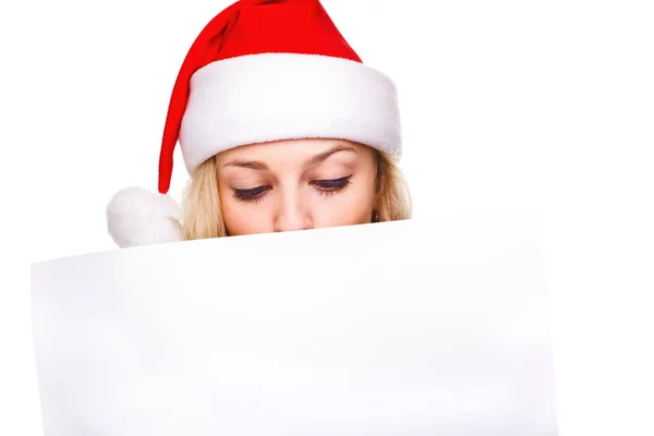 Noel Baba şapkası boş tahta tutan kadın — Stok fotoğraf