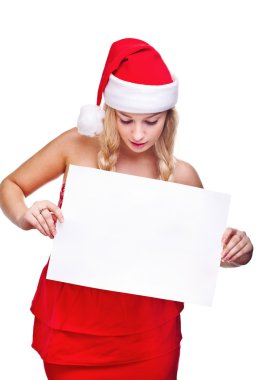 Noel Baba şapkası boş tahta tutan kadın