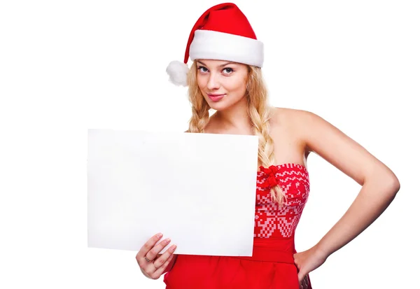 Woman in santa hat holding empty board — Stock Photo, Image