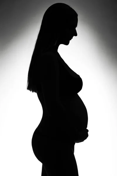 Donna incinta silhouette — Foto Stock