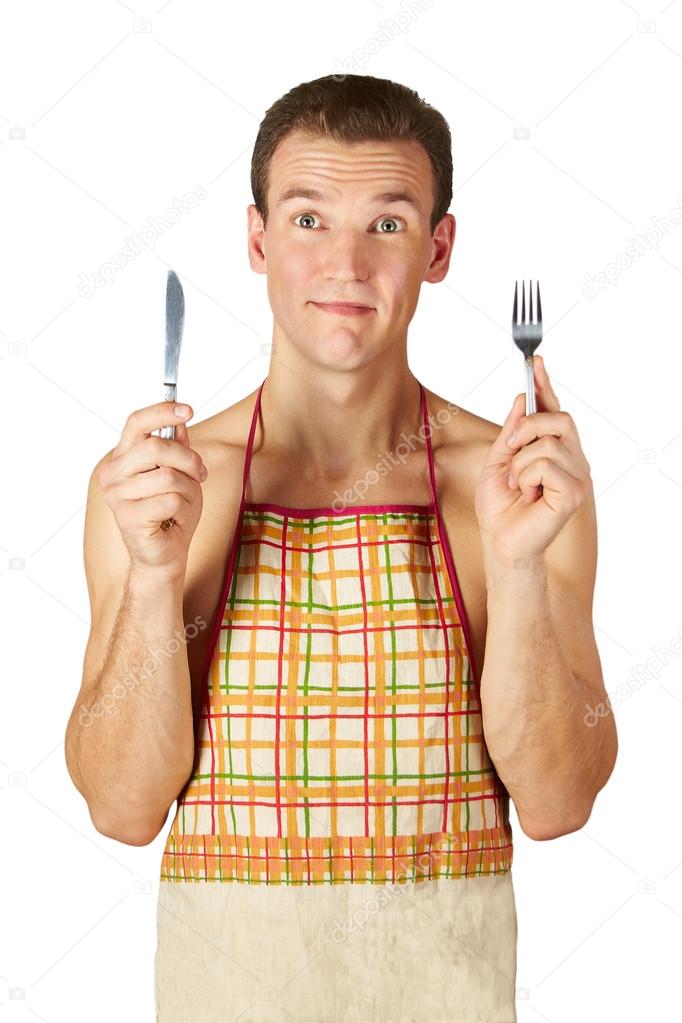Men in an apron, with a knife and a fork on a white bac