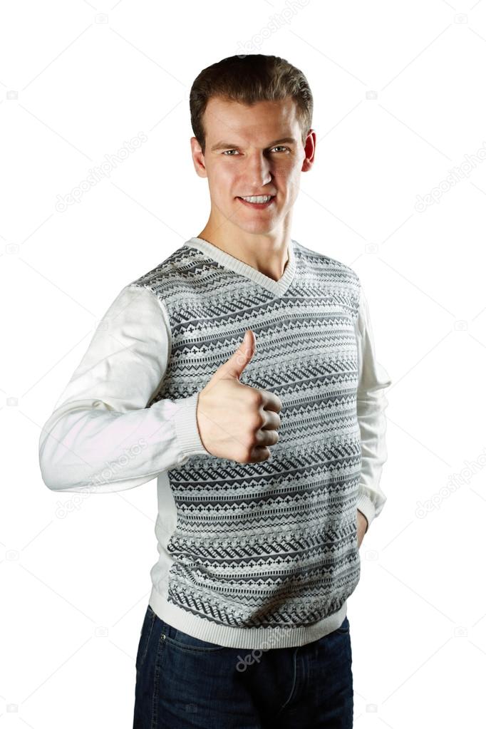 Men in a white sweater with a figure shows okey gesture
