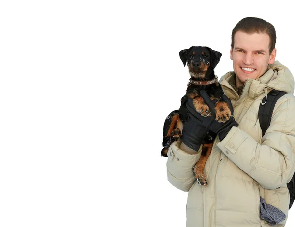 Smiling man keeps in a light winter jacket and a backpa — Stock Photo, Image