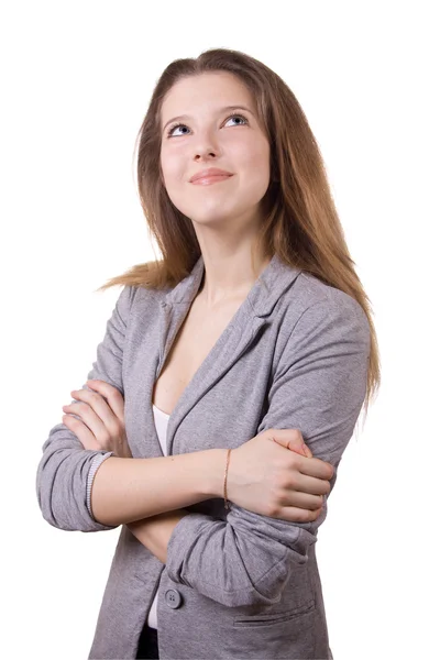 The long-haired girl in a gray jacket dreams of something, looki — Stock Photo, Image