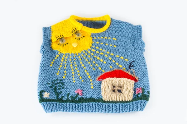 Children's knitted vest with house in the sun — Stock Photo, Image