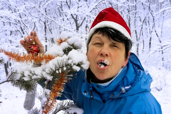 Cheerful woman with snow in the mouth — Stock Photo, Image