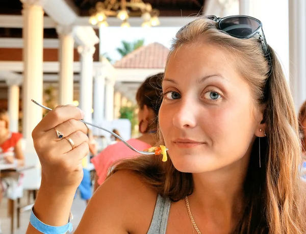 Girl behind cafe table — Stock Photo, Image