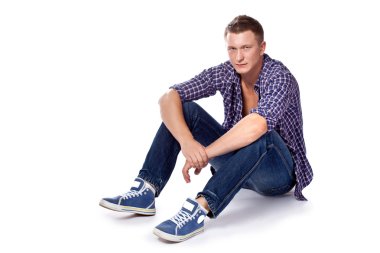 Sexy handsome man posing in casual wear clipart