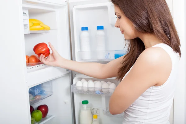 Woman searching in her fridge — Stock Photo, Image