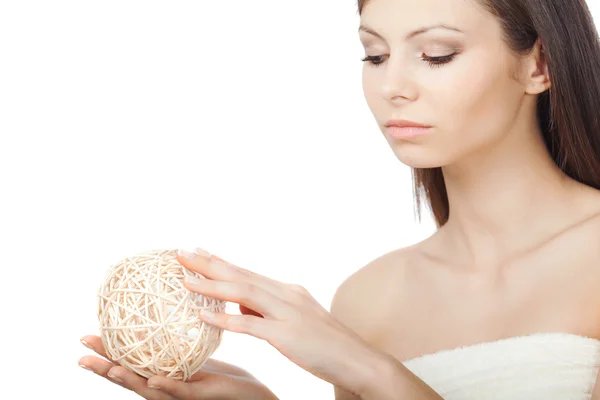 Woman holding wooden ball — Stock Photo, Image