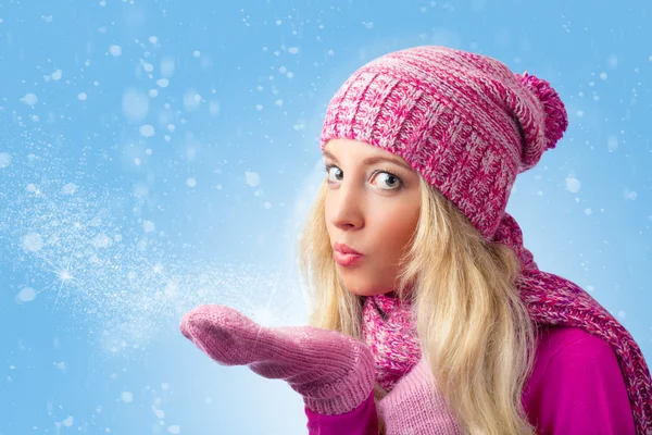 Woman blowing to snowflakes — Stock Photo, Image