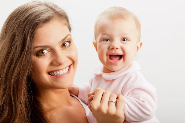 Young mother holding her baby girl on hands — Stock Photo, Image
