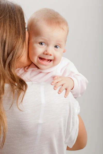 Mothers back view and baby on shoulder — Stock Photo, Image