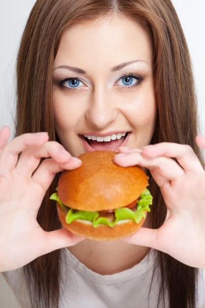 Woman going to eat hamburger Stock Image