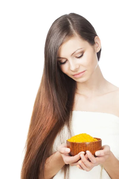 Woman holding bowl of sea salt — Stock Photo, Image