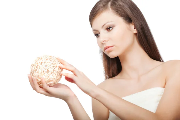 Woman holding wooden ball — Stock Photo, Image