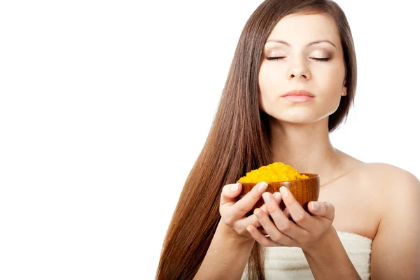 Woman holding bowl of sea salt — Stock Photo, Image