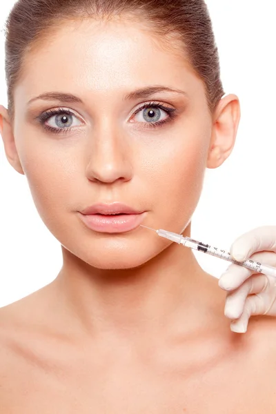 Woman face and syringe — Stock Photo, Image