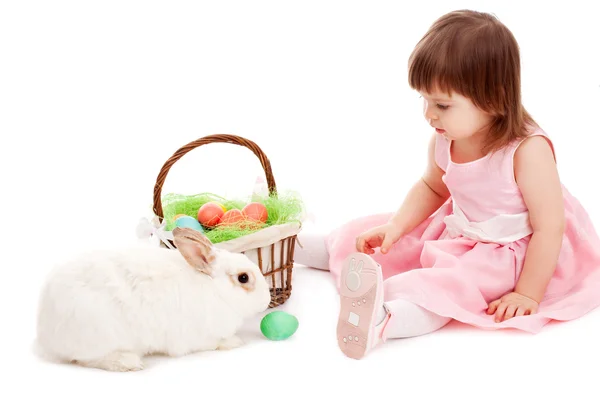 Little girl playing with fur eatser rabbit — Stock Photo, Image