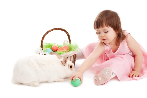 Little girl playing with fur eatser rabbit — Stock Photo, Image