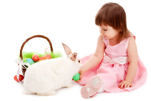 Little girl playing with fur eatser rabbit — Stock Photo, Image