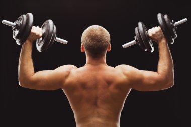 adam excersizing dumbbells ile