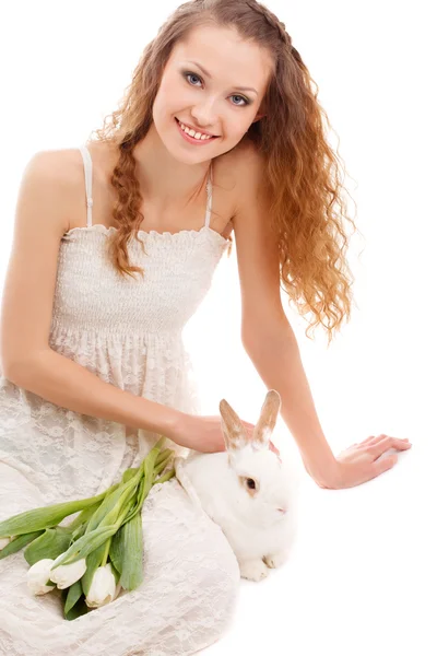 Happy woman sitting on the floor — Stock Photo, Image