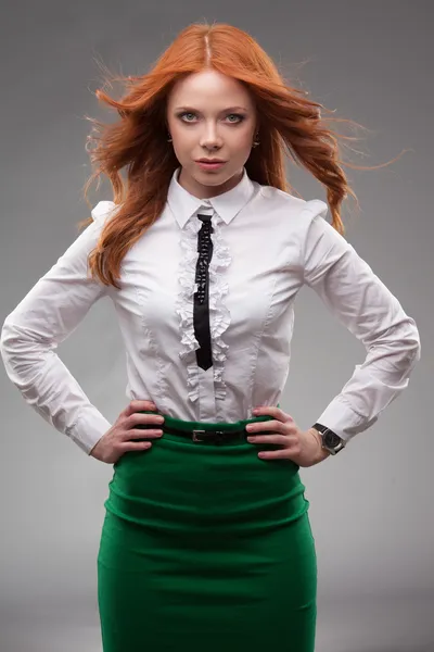 Red-haired businesswoman portrait over gray — Stock Photo, Image