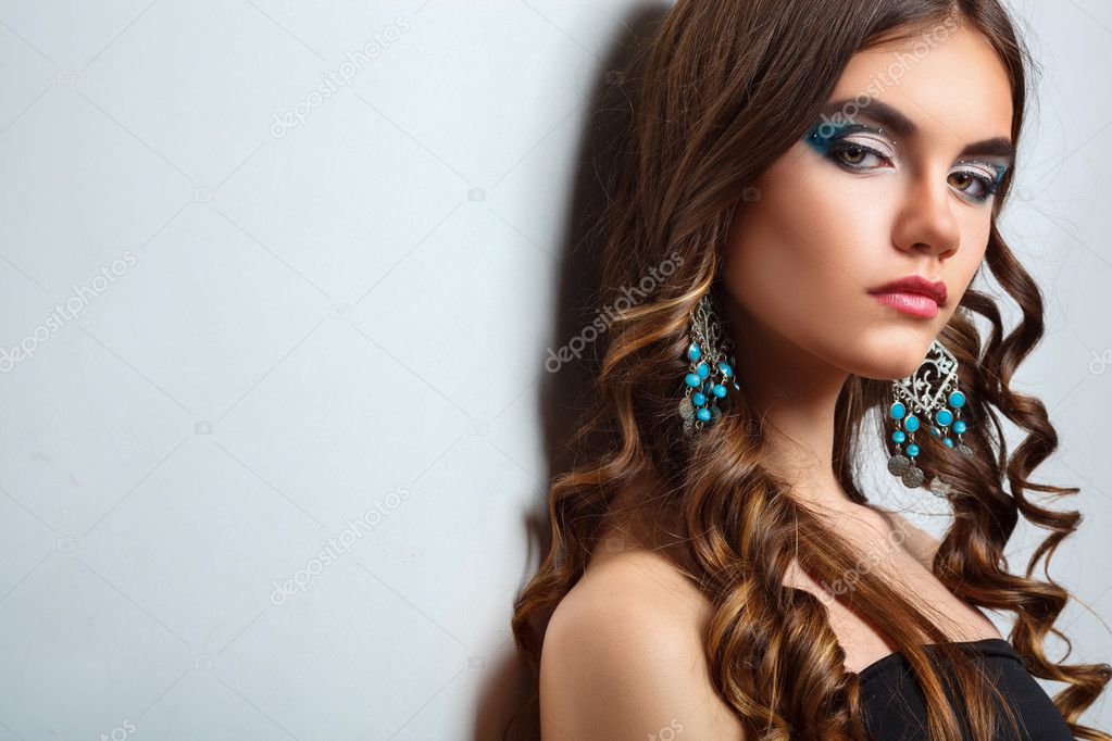 brunette girl with long hair and creative makeup