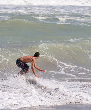 Teen Skimboarder