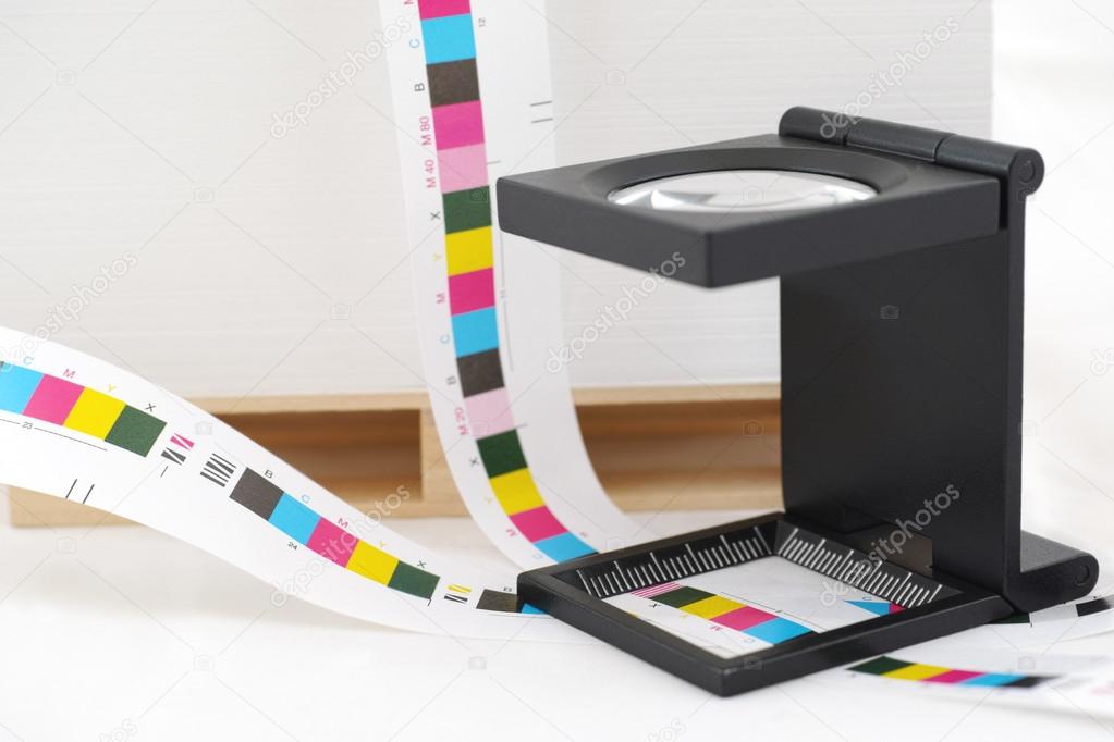 CMYK printing color bar and loupe.