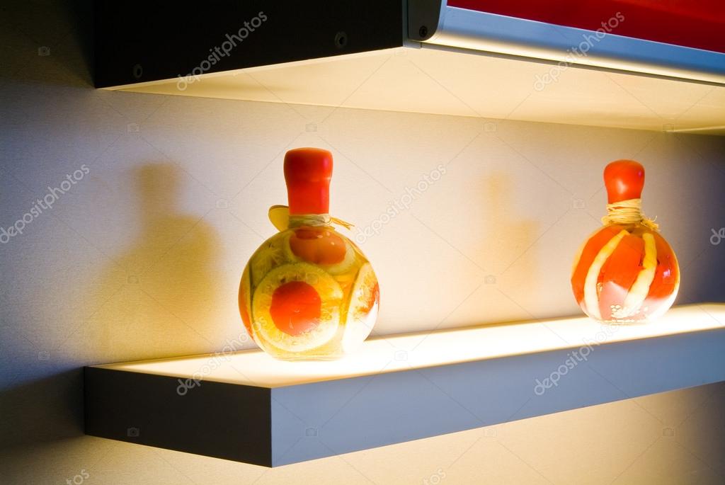 Two decorative bottles on light table on kitchen — Stock Photo