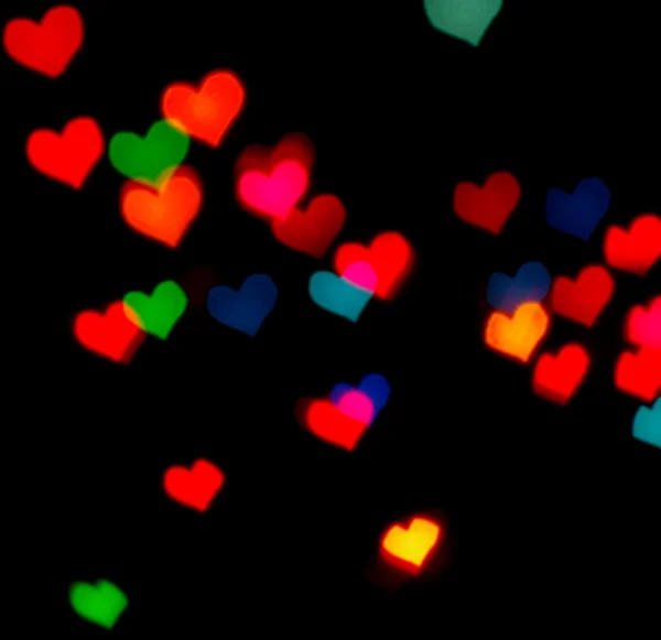 Valentine's Day card background with blur defocusing colour hear — Stock Photo, Image