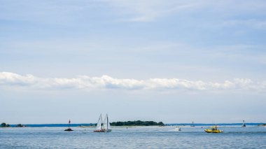 NORWALK, CT USA - JULY 27, 2022: View from Calf Pasture beach in summer day with boats and copy space