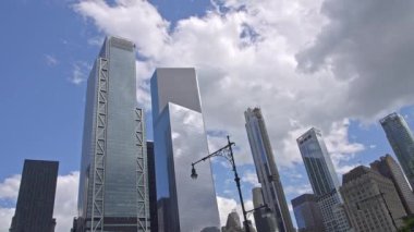 NEW YORK, NY - JUNE 9, 2022: Modern skyscrapers buildings near West Street highway in nice sunny day, time lapse.