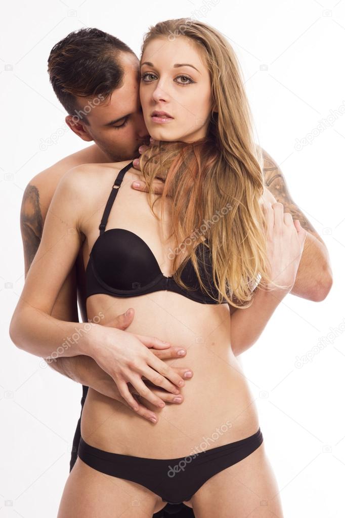 Sexy passionate young couple on white isolated background
