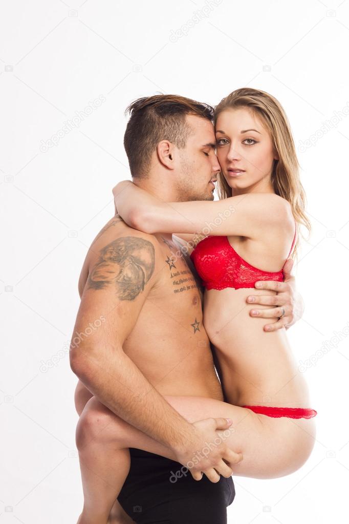 Sexy young passion couple on white isolated background