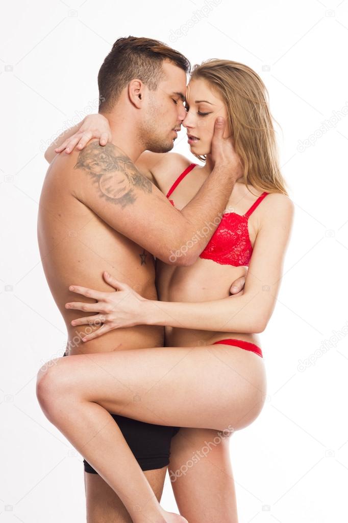 Sexy young passion couple on white isolated background