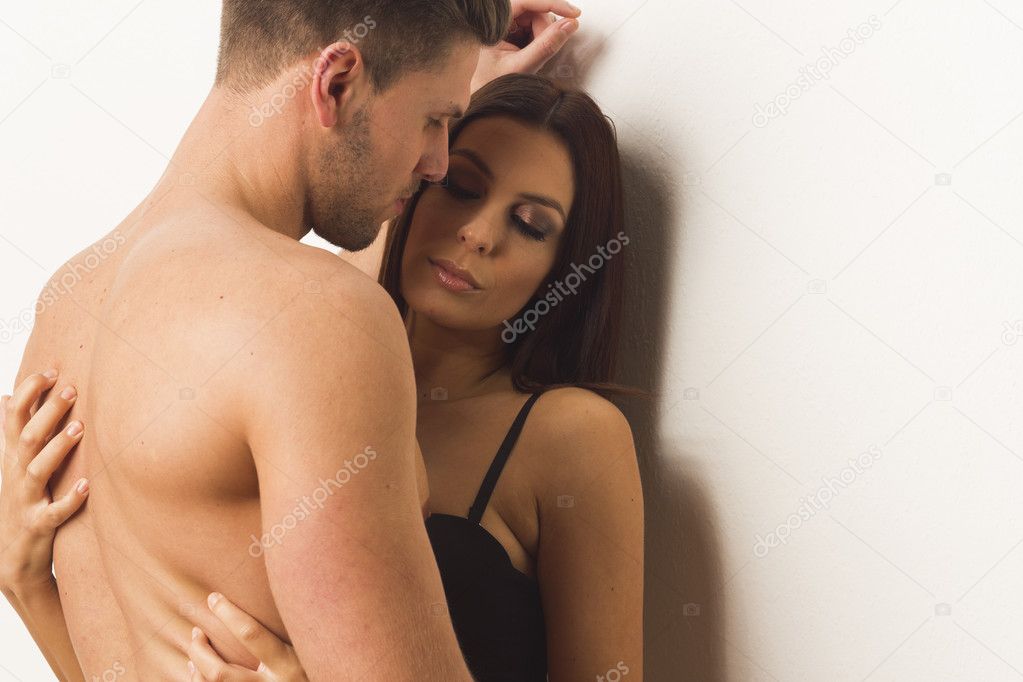 Young sexy passionate couple embracing