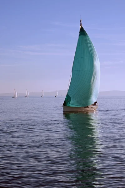 Sailboat with green spinnaker — Stock Photo, Image