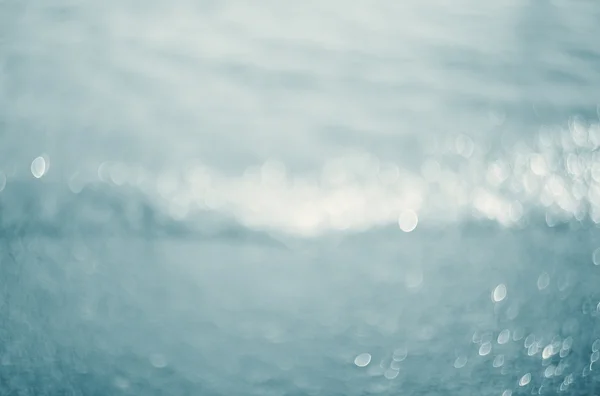 Luces sobre fondo azul.Ondas.Bajo el agua . — Foto de Stock