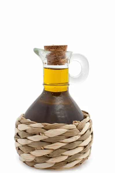 Olivenöl in einer mit Stroh gefüllten Flasche — Stockfoto