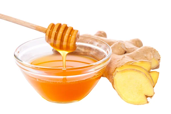 Miel y jengibre aislados con camino Imagen de stock