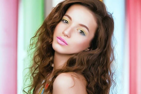 Portrait of young beautiful girl on bright colored background. — Stock Photo, Image