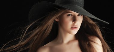Face of woman with beautiful lips in hat. clipart