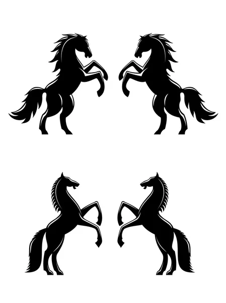 Two rearing up horses silhouettes — Stock Vector
