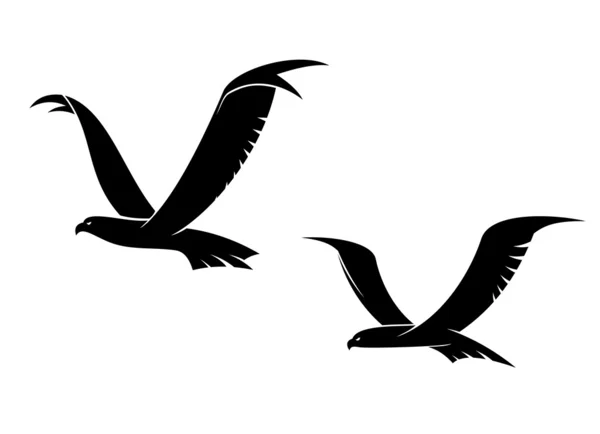 Dos pájaros voladores en silueta — Vector de stock