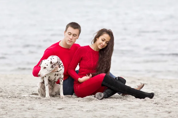 Romantic couple with a dog — Stock Photo, Image